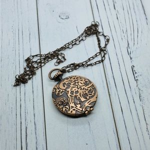 Large copper metal locket.